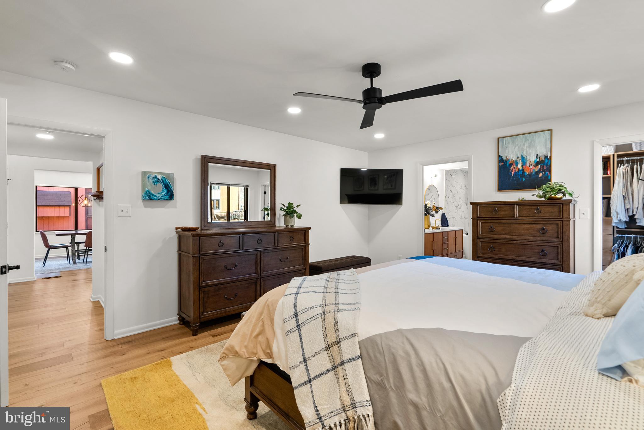 5213 Bradfield Drive Burke, VA 22015 - Photo 16 of 48 a bedroom with a bed and wooden floor