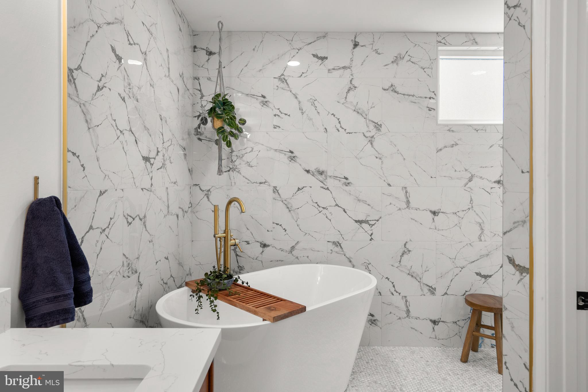 5213 Bradfield Drive Burke, VA 22015 - Photo 18 of 48 a bath tub sitting in a bathroom and a shower