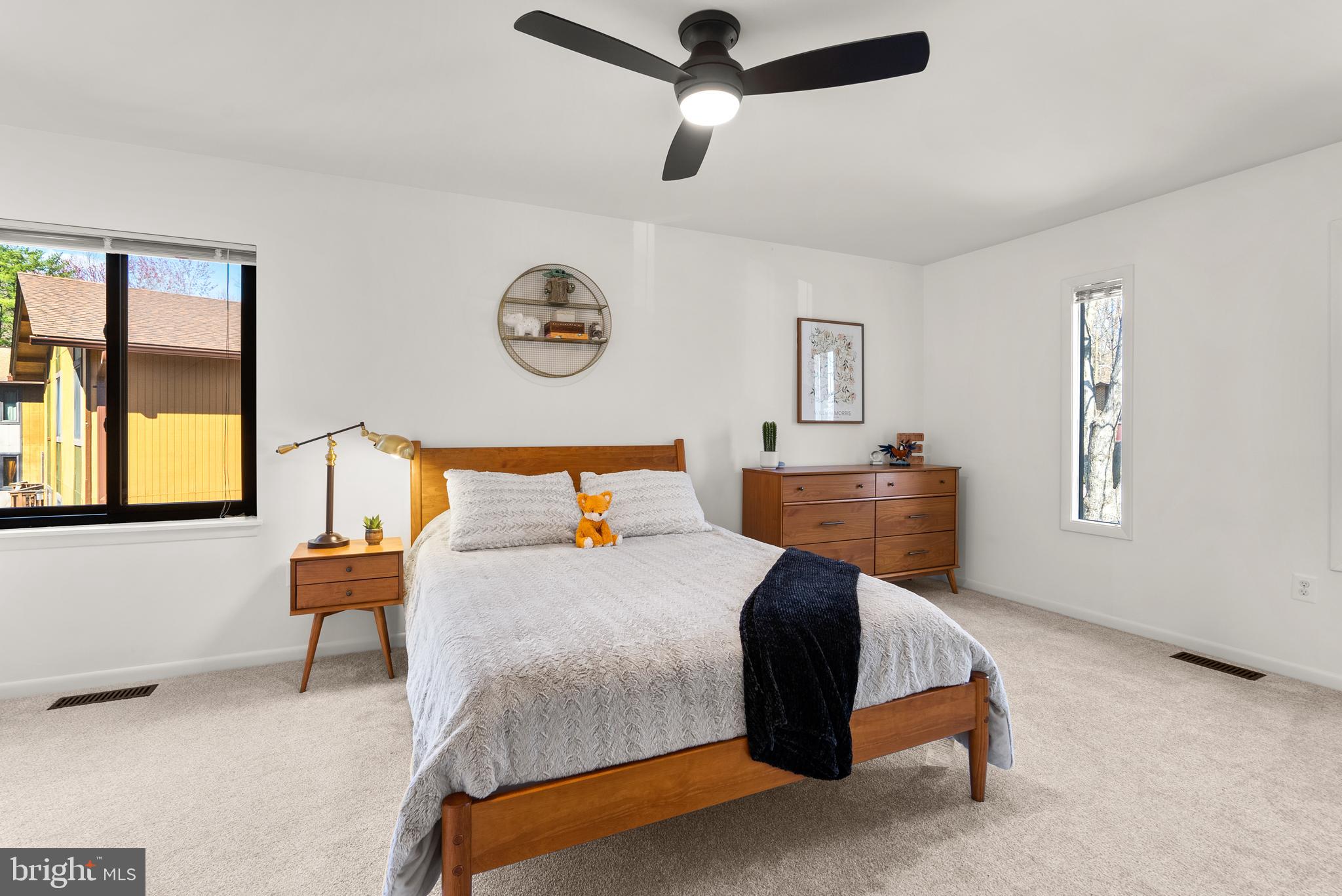 5213 Bradfield Drive Burke, VA 22015 - Photo 23 of 48 a bedroom with a bed a table and chair