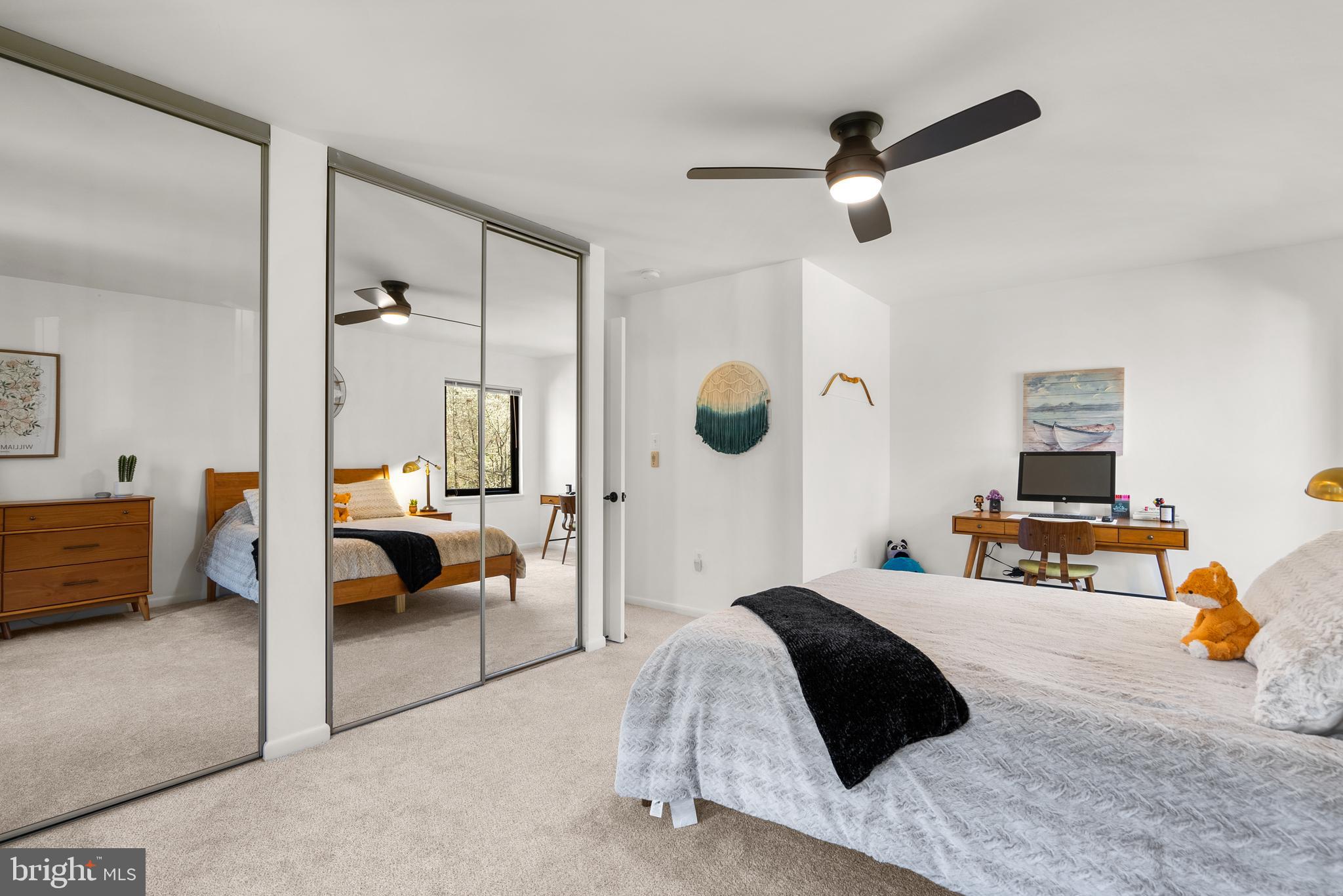 5213 Bradfield Drive Burke, VA 22015 - Photo 24 of 48 a bedroom with a bed and a chandelier