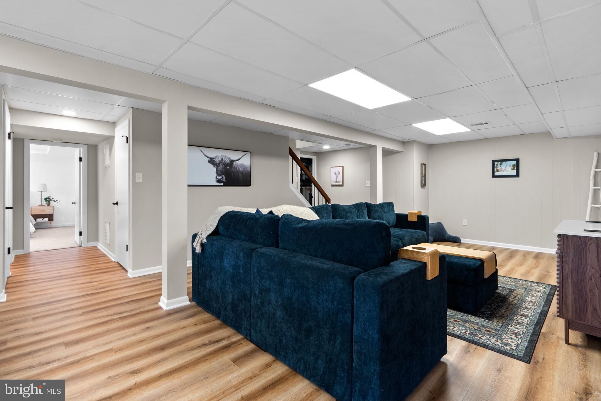 5213 Bradfield Drive Burke, VA 22015 - Photo 31 of 48 a living room with furniture and a wooden floor