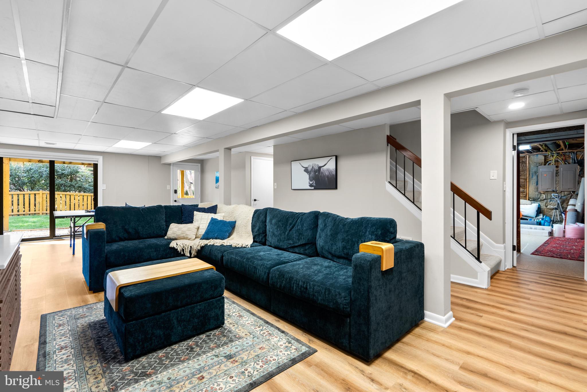5213 Bradfield Drive Burke, VA 22015 - Photo 32 of 48 a living room with furniture and wooden floor