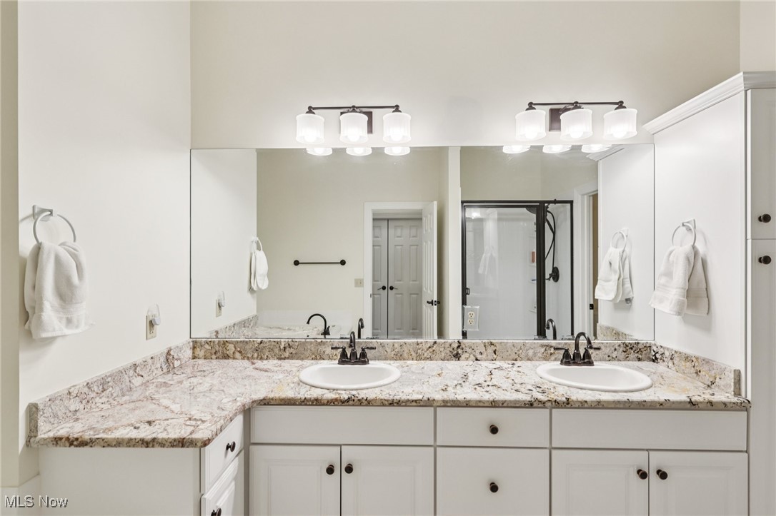 249 Granger Road, Unit 87 Medina, OH 44256 - Photo 22 of 38 Bathroom with double vanity and a stall shower