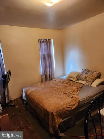 a bedroom with a bed and a table