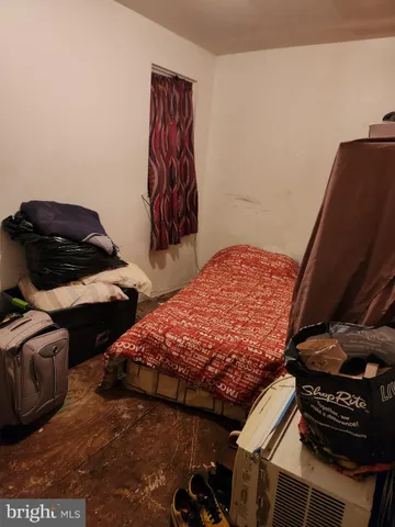 a bedroom with a bed and a closet