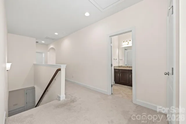 a view of a hallway with a dining room