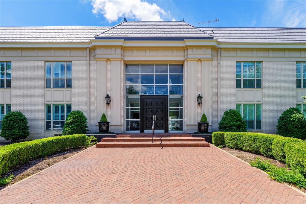 6126 Averill Way, Unit 103W Dallas, TX 75225 - Photo 25 of 34 a front view of a house with a yard