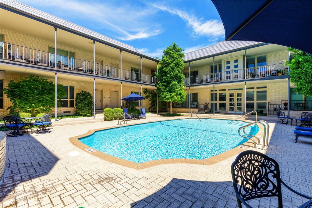 6126 Averill Way, Unit 103W Dallas, TX 75225 - Photo 29 of 34 a view of a house with a swimming pool and sitting area