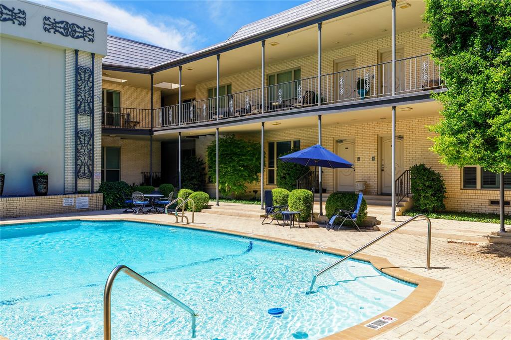 6126 Averill Way, Unit 103W Dallas, TX 75225 - Photo 30 of 34 a building outdoor space with patio view mirror and potted plants
