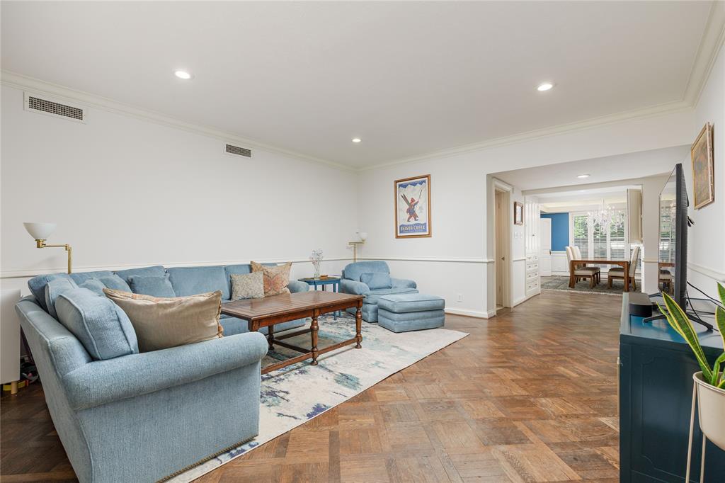 6126 Averill Way, Unit 103W Dallas, TX 75225 - Photo 3 of 34 a living room with furniture and wooden floor