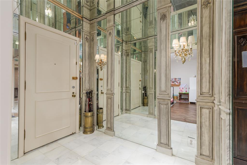 6126 Averill Way, Unit 103W Dallas, TX 75225 - Photo 33 of 34 a view of a bathroom with a glass door shower