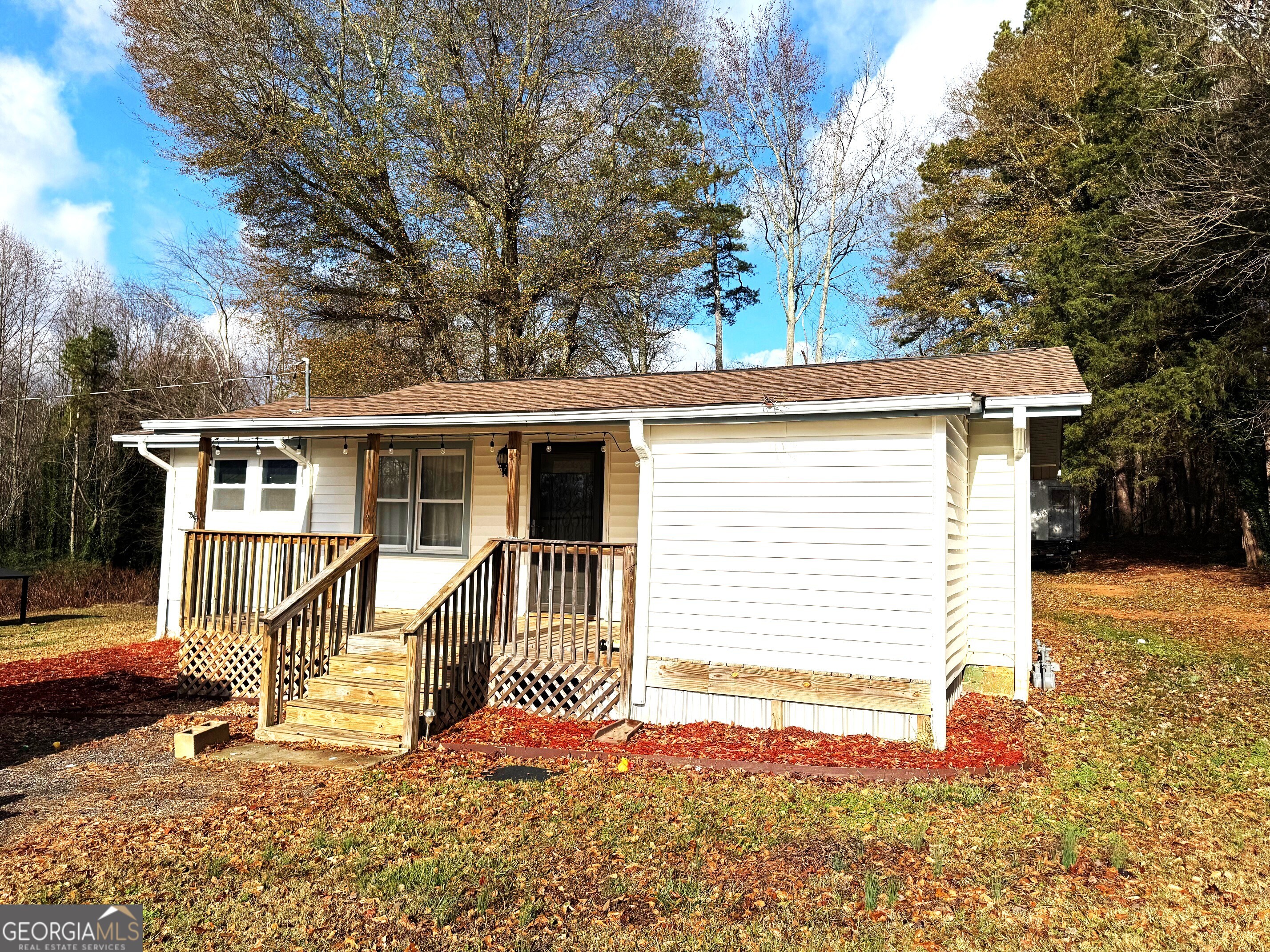 a view of a house with a snow on the road