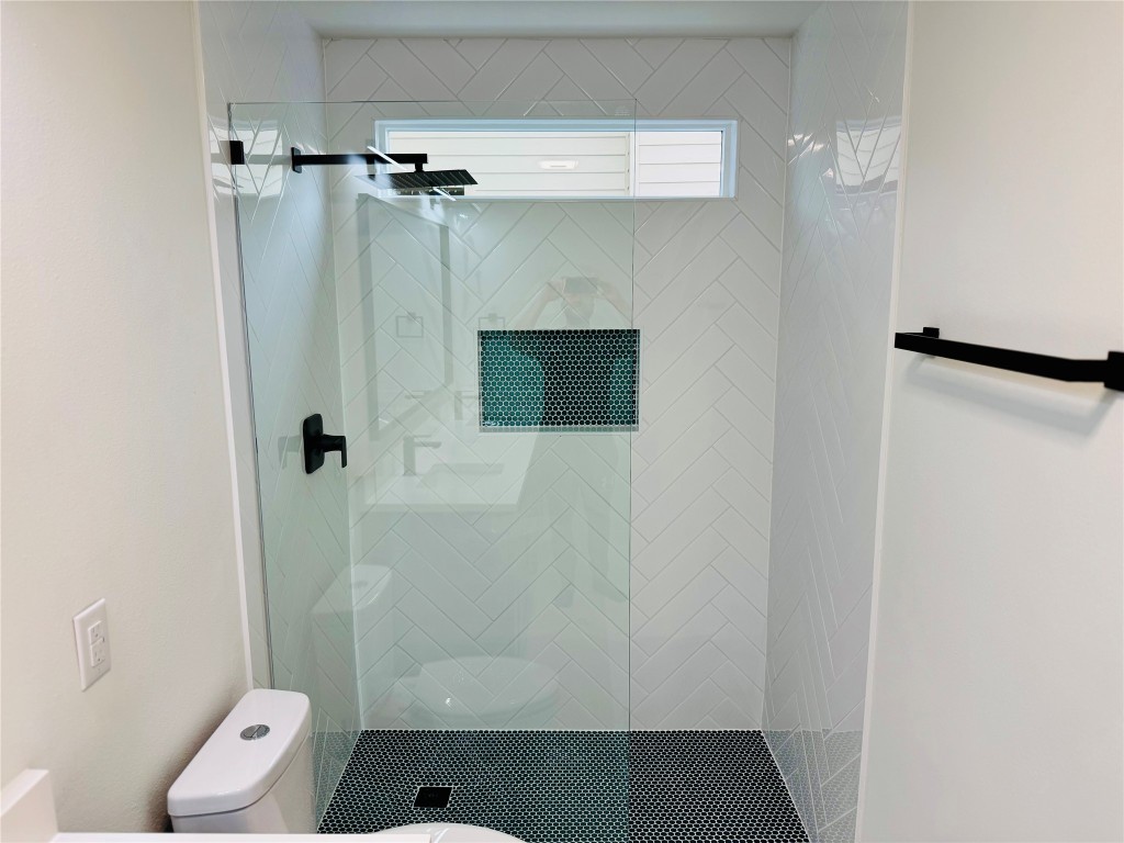 5013 Cana Cove, Unit B Austin, TX 78749 - Photo 17 of 25 a bathroom with a shower and toilet
