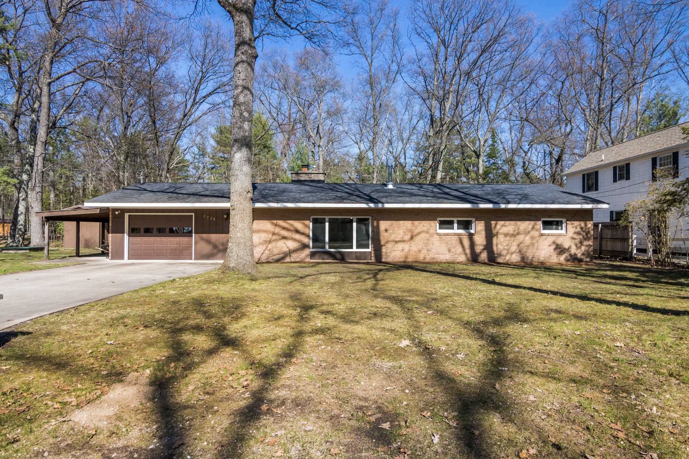 7736 Ladd Road Rapid City, MI 49676 - Photo 1 of 42