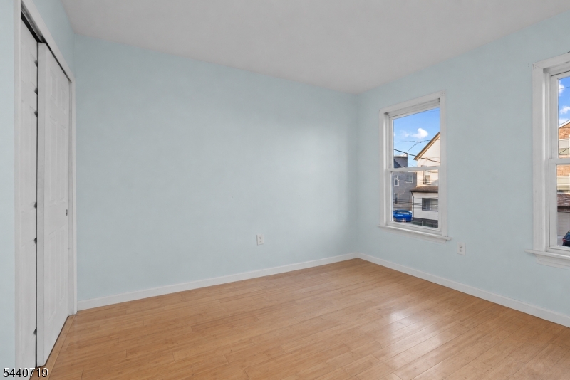136 Smith Street Elizabeth, NJ 07201 - Photo 21 of 38 a view of an empty room with window and closet area