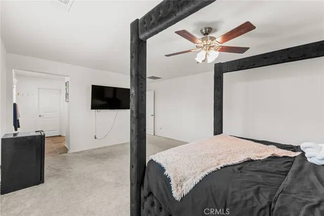 a spacious bathroom with a granite countertop sink toilet and shower