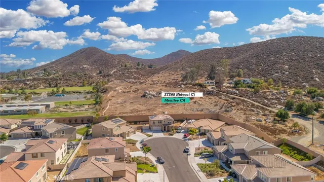 an aerial view of residential building with yard