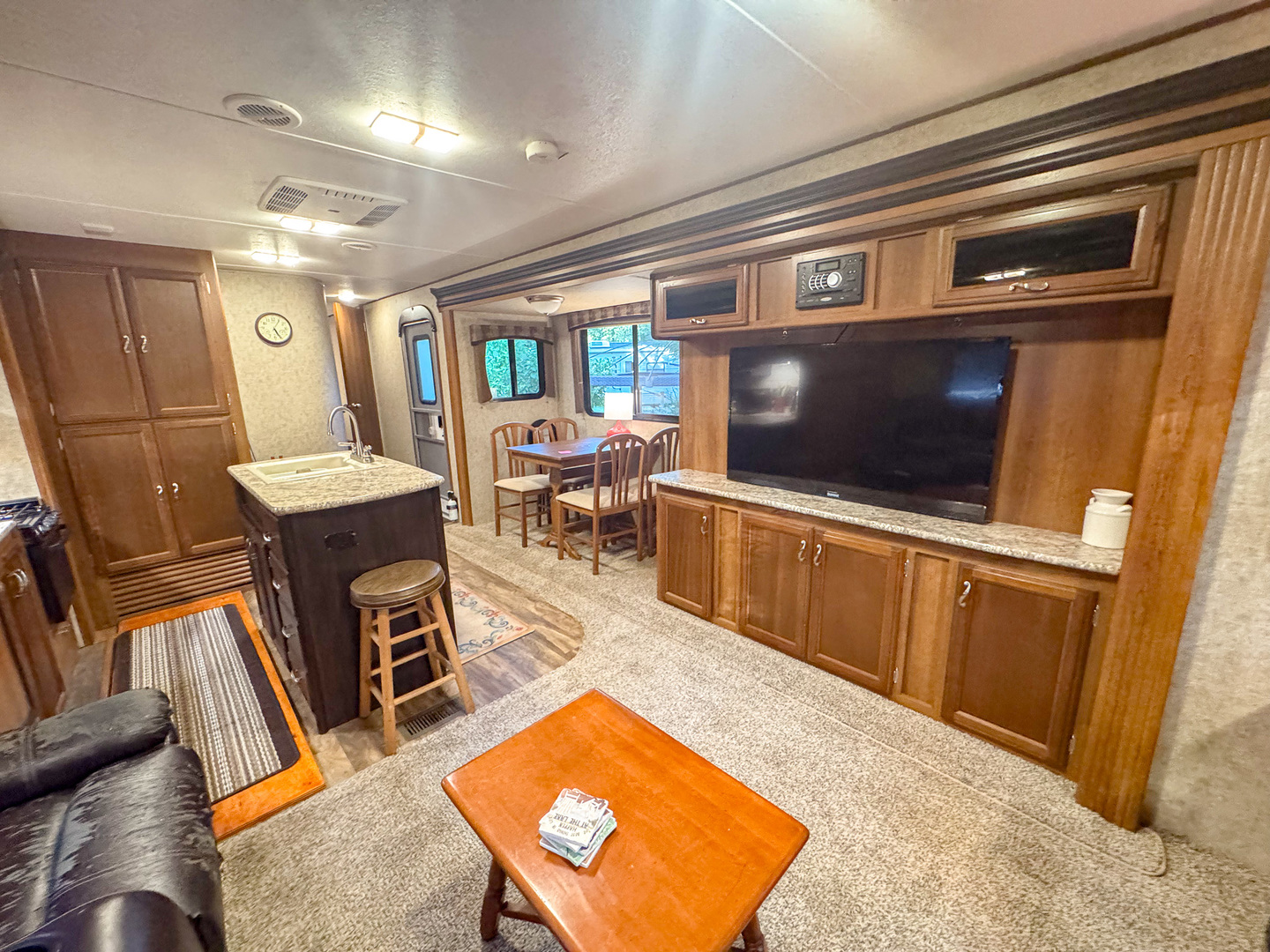 4-176 Woodhaven Sublette, IL 61367 - Photo 14 of 19 a living room with stainless steel appliances furniture a rug and a kitchen view