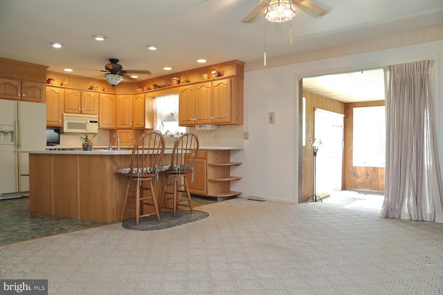 543 Hossler Road Manheim, PA 17545 - Photo 6 of 26 a view of a kitchen with kitchen island a large window