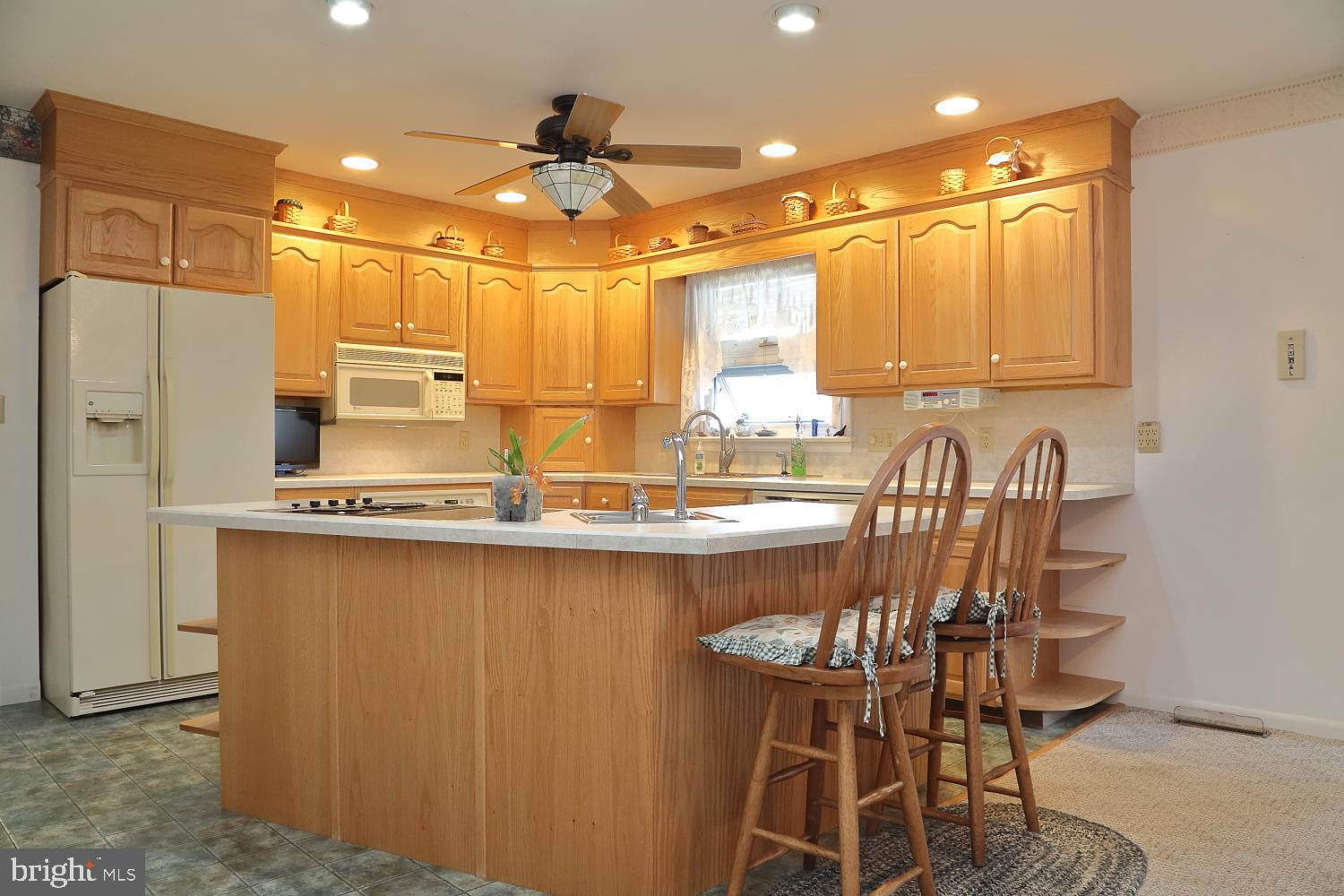 543 Hossler Road Manheim, PA 17545 - Photo 7 of 26 a large kitchen with a table and chairs