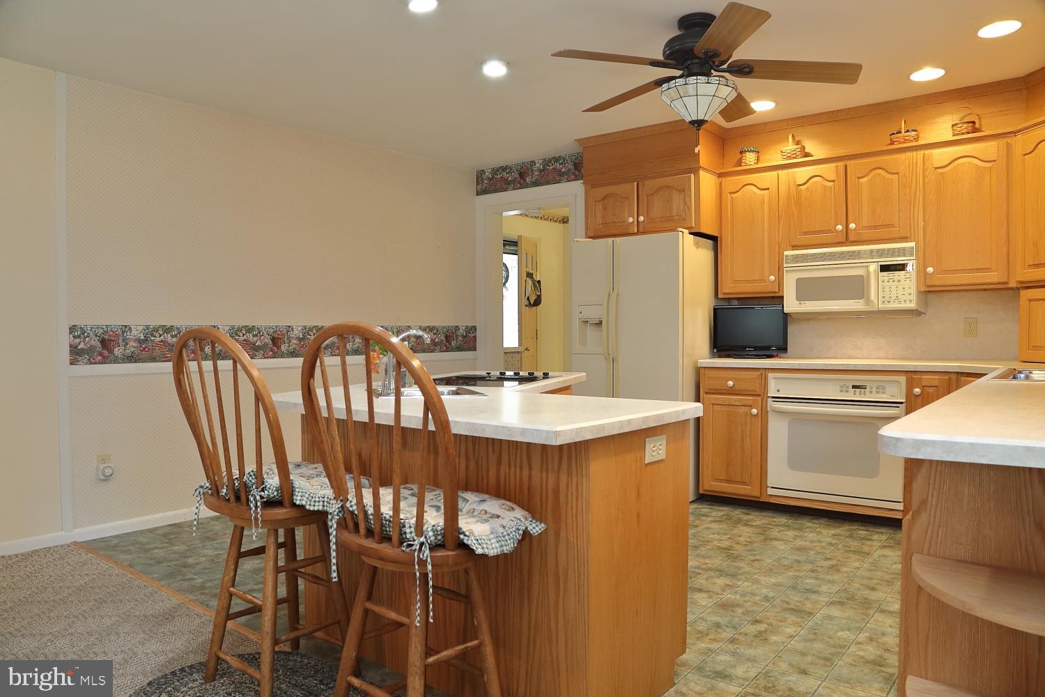 543 Hossler Road Manheim, PA 17545 - Photo 8 of 26 a kitchen with stainless steel appliances a table and chairs