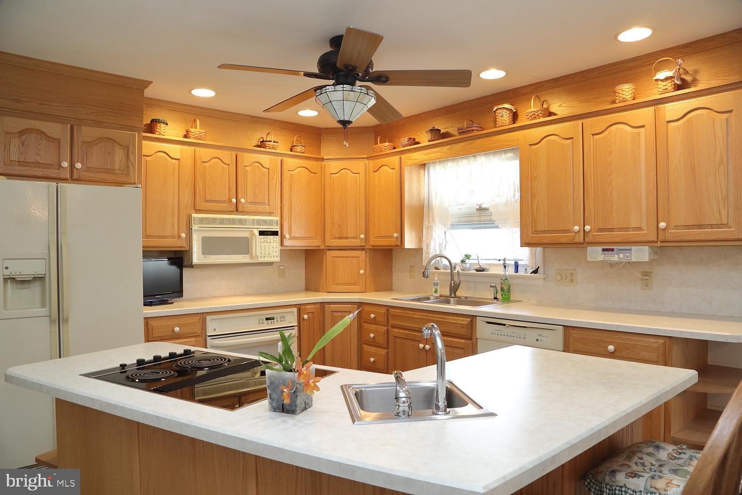 543 Hossler Road Manheim, PA 17545 - Photo 10 of 26 a kitchen with a sink a stove and a refrigerator