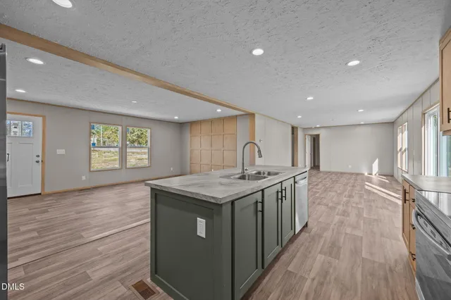 a kitchen with a stove and a sink