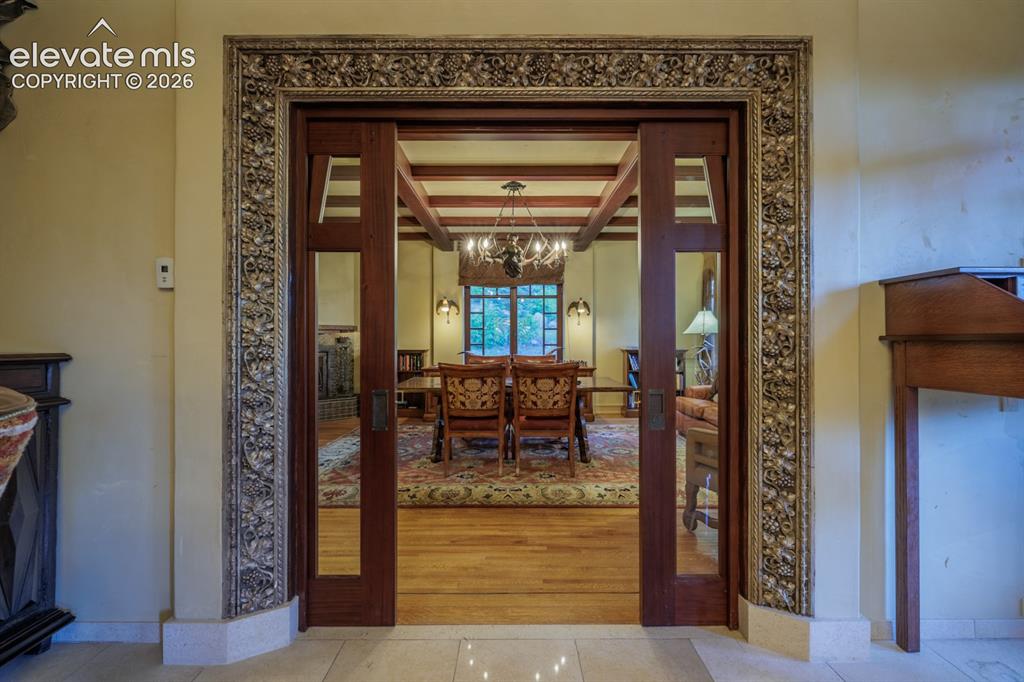 4530 Governors Point Colorado Springs, CO 80906 - Photo 43 of 49 Entrance to library/office in private north wing of the home. Exterior entrance from driveway and separate apartment and garage below. Custom mahogany pocket doors throughout the home add privacy