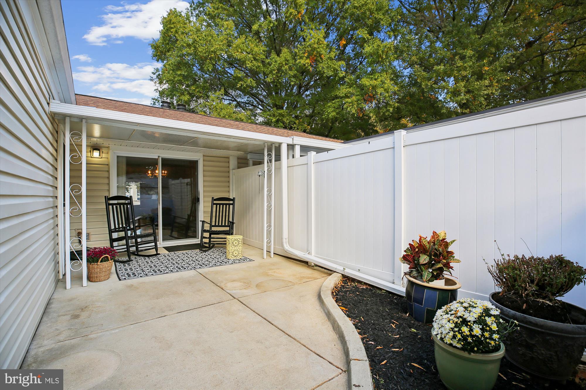 3220 Ludham Drive, Unit 196A Silver Spring, MD 20906 - Photo 19 of 28 a front view of a house with outdoor seating