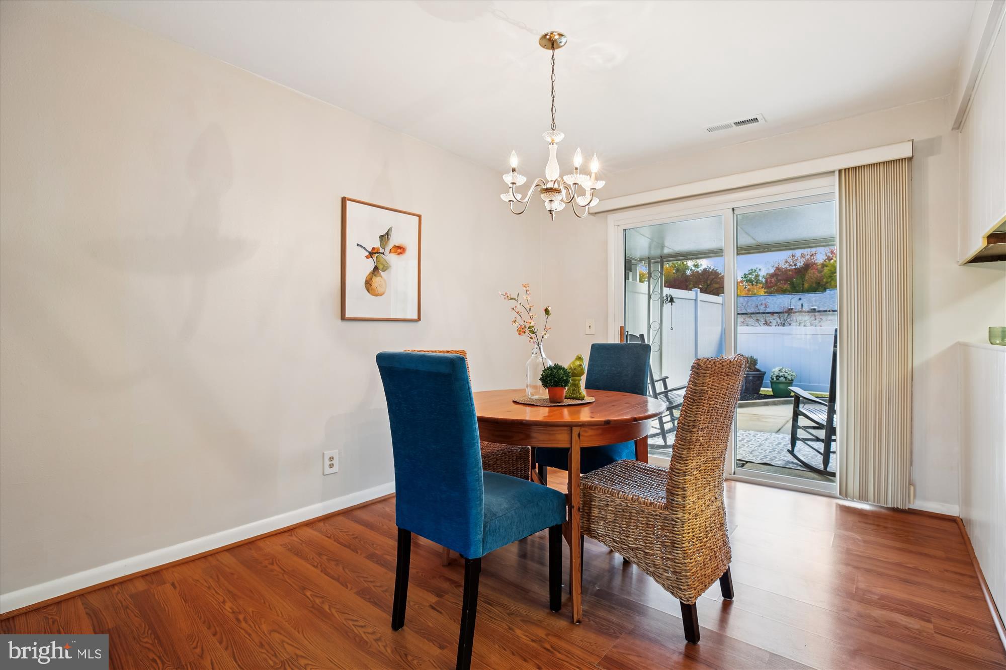 3220 Ludham Drive, Unit 196A Silver Spring, MD 20906 - Photo 6 of 28 a view of a dining room with furniture wooden floor and a chandelier
