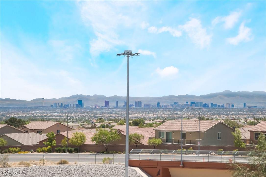 6432 Spring Jog Street Las Vegas, NV 89166 - Photo 29 of 61 City skyline views stretch across the horizon, complementing the neighborhood's distant mountain backdrop.