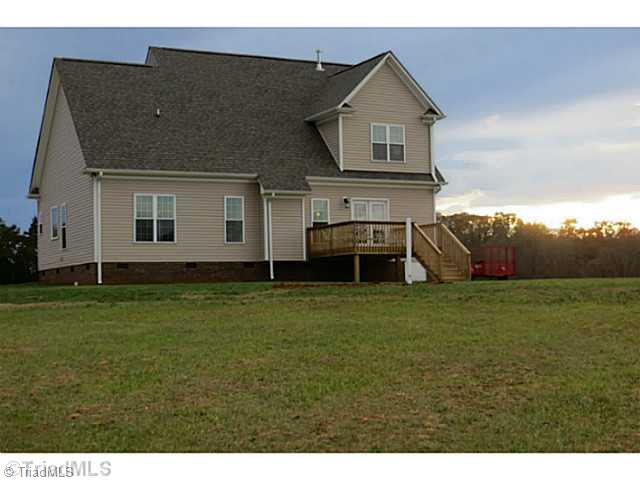 7482 Princess Ann Court Rural Hall, NC 27045 - Photo 15 of 16 Exterior Back. Great deck to enjoy the sunset.