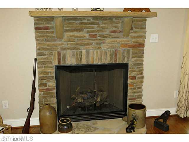 7482 Princess Ann Court Rural Hall, NC 27045 - Photo 7 of 16 Den/Family/Great Room. Lovely stone fireplace with gas logs.
