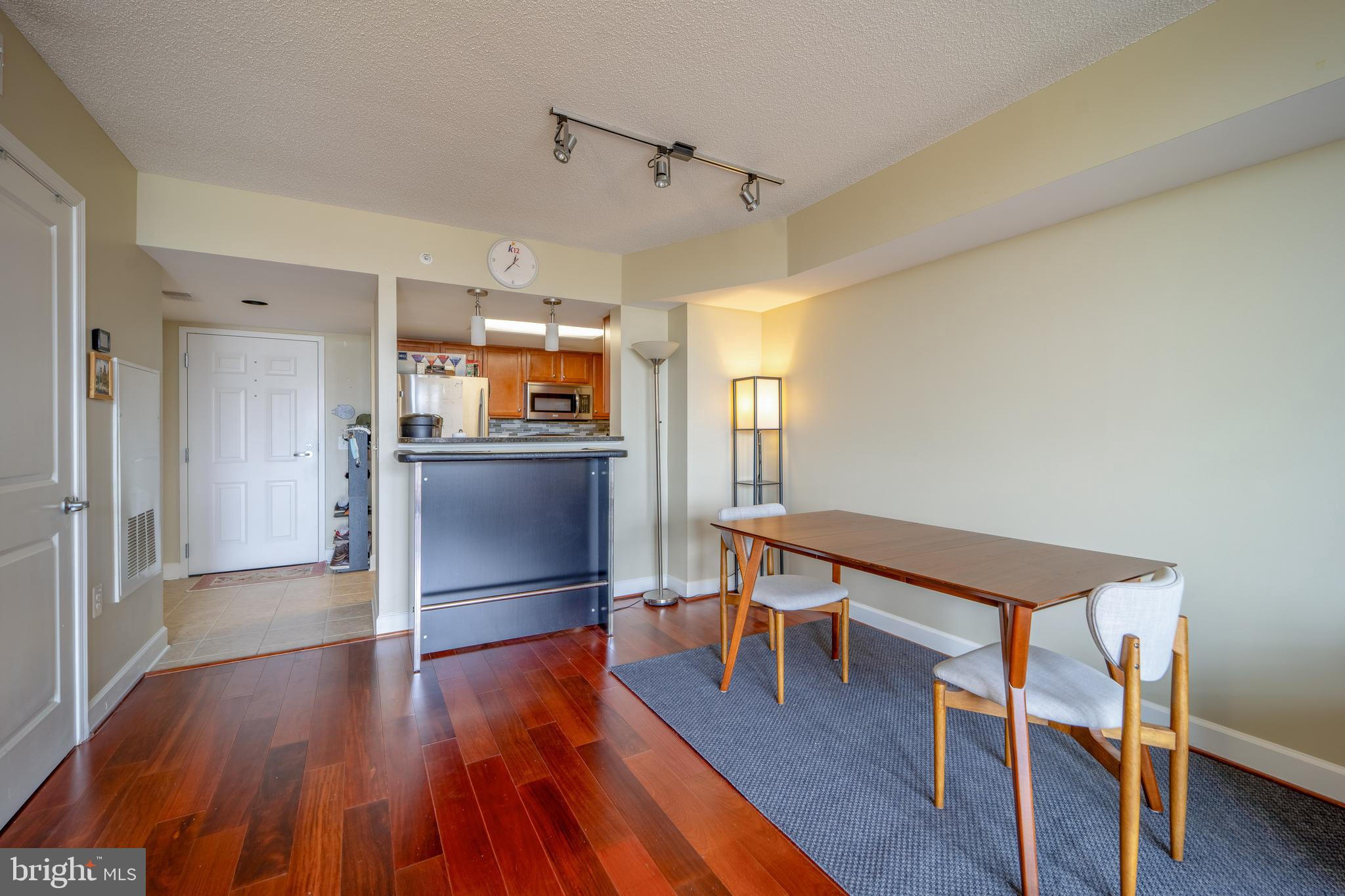 11800 Sunset Hills Road, Unit 925 Reston, VA 20190 - Photo 11 of 49 a view of a kitchen with furniture and wooden floor