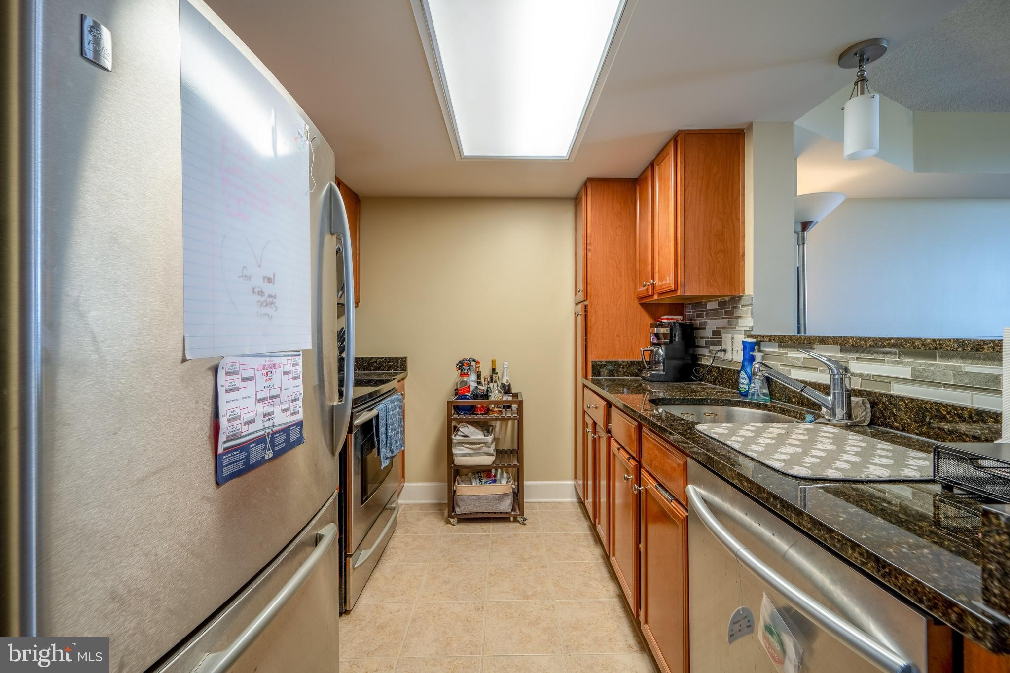 11800 Sunset Hills Road, Unit 925 Reston, VA 20190 - Photo 14 of 49 a kitchen with stainless steel appliances granite countertop a stove and a refrigerator