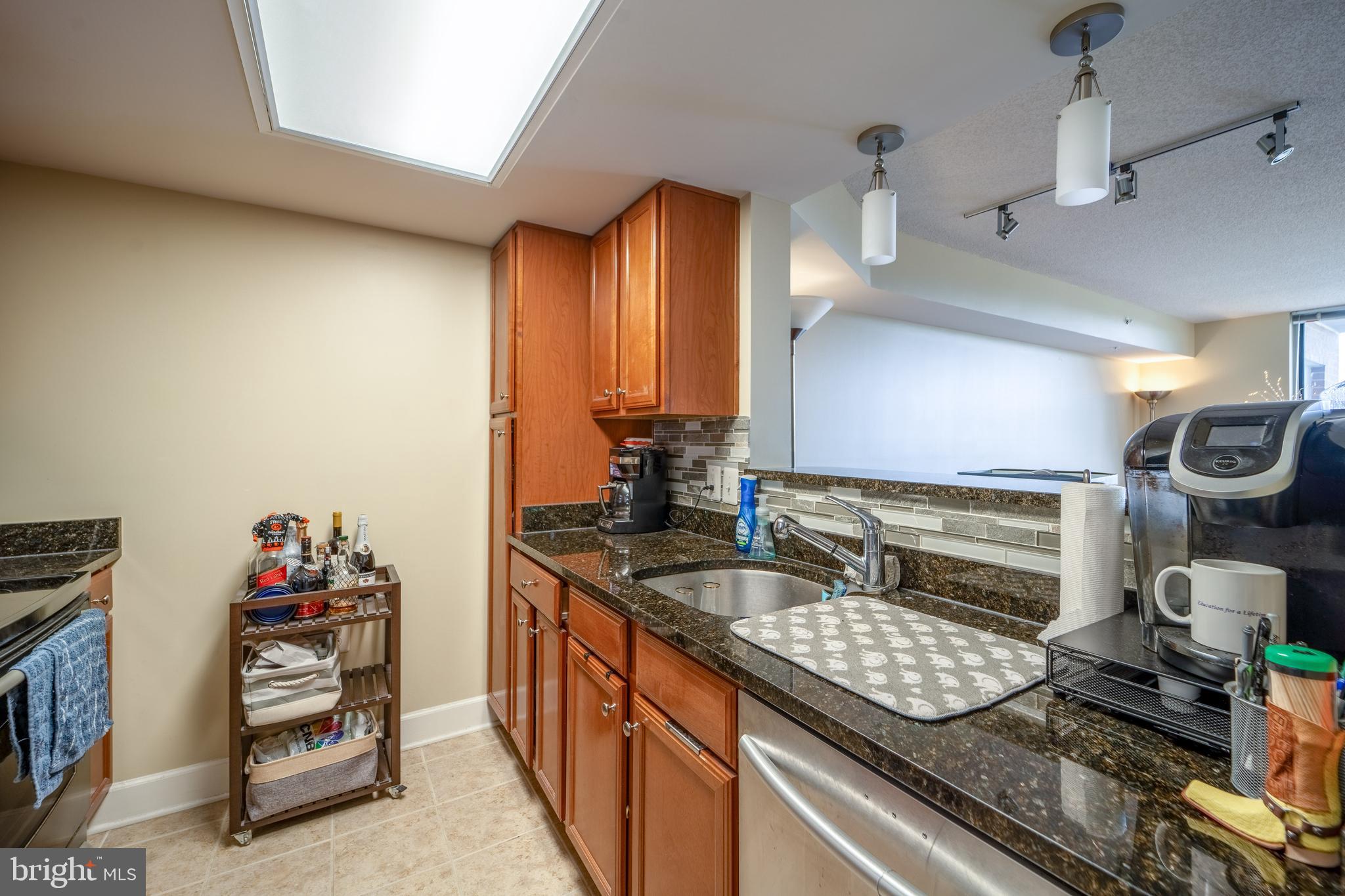 11800 Sunset Hills Road, Unit 925 Reston, VA 20190 - Photo 15 of 49 a kitchen with sink and cabinets