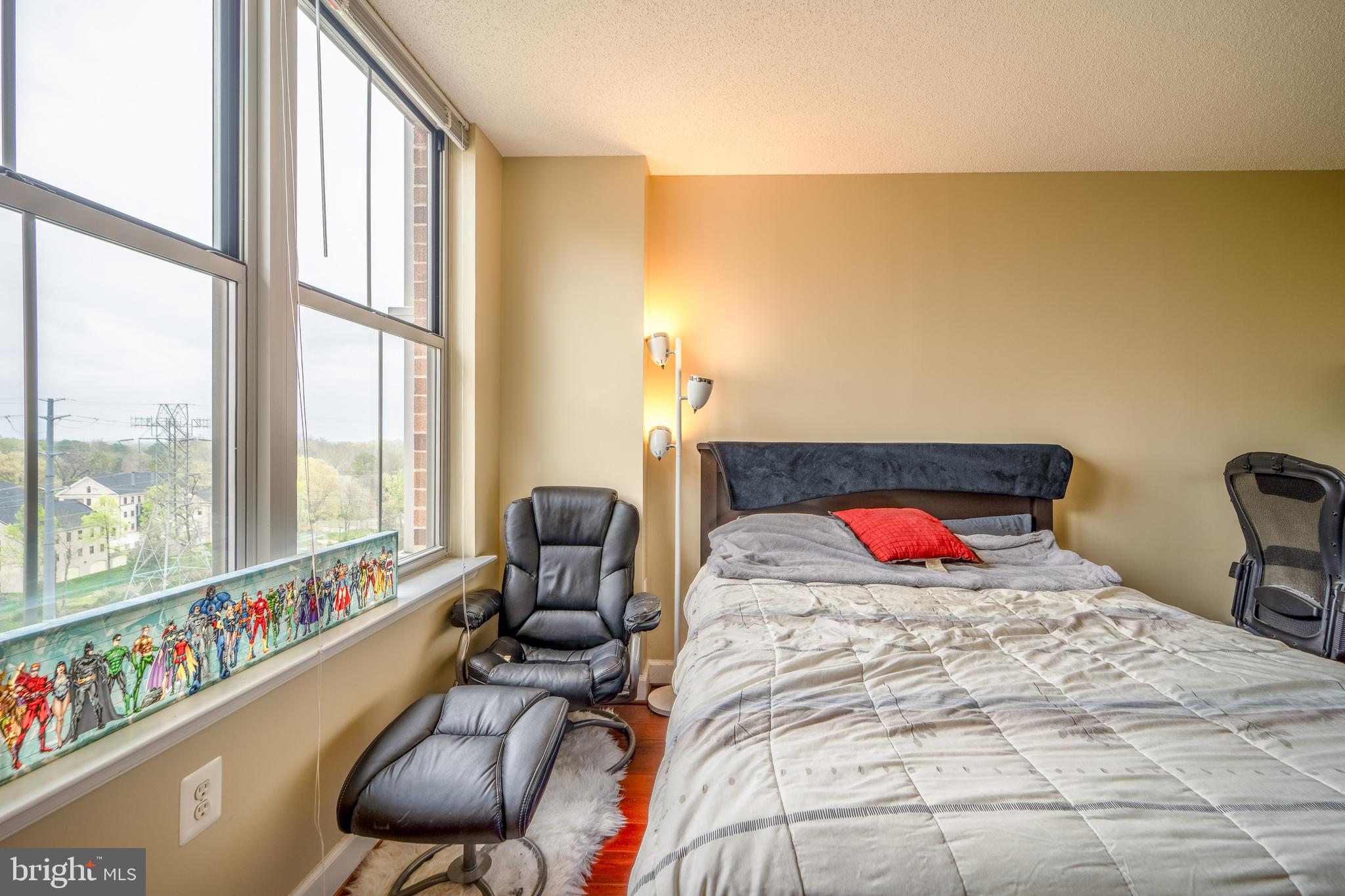 11800 Sunset Hills Road, Unit 925 Reston, VA 20190 - Photo 21 of 49 a bed sitting in a bedroom next to a window