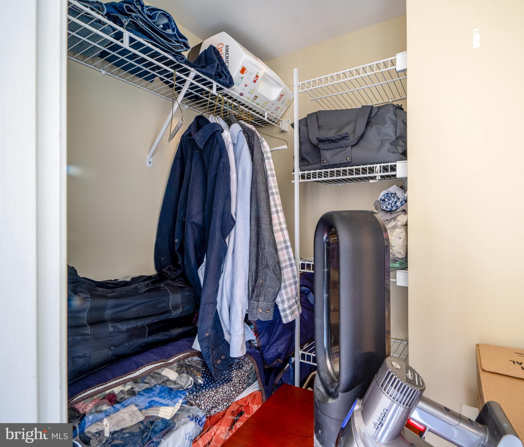 11800 Sunset Hills Road, Unit 925 Reston, VA 20190 - Photo 28 of 49 a view of walk in closet with clothes and shoes