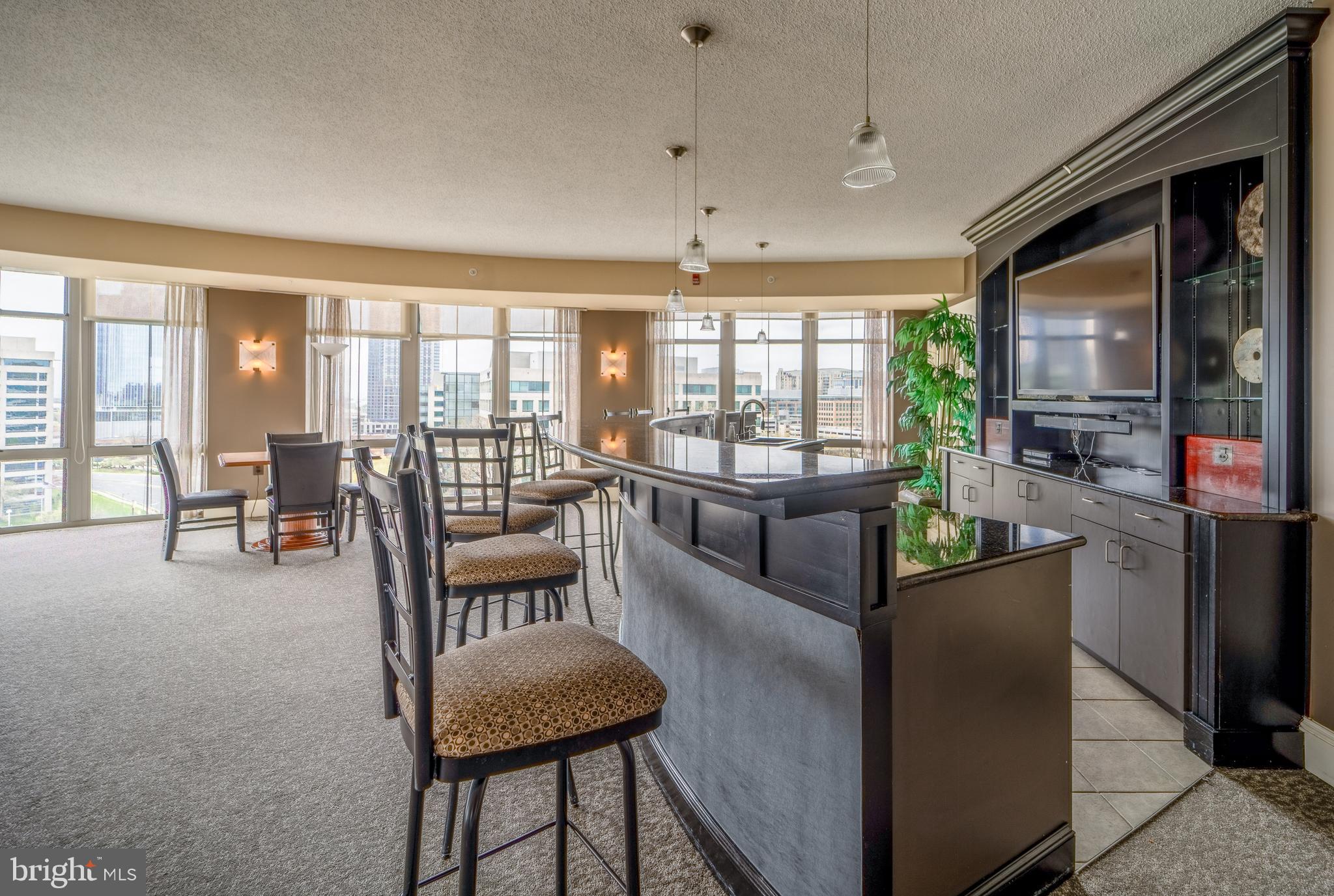 11800 Sunset Hills Road, Unit 925 Reston, VA 20190 - Photo 36 of 49 a living room with furniture and a large window