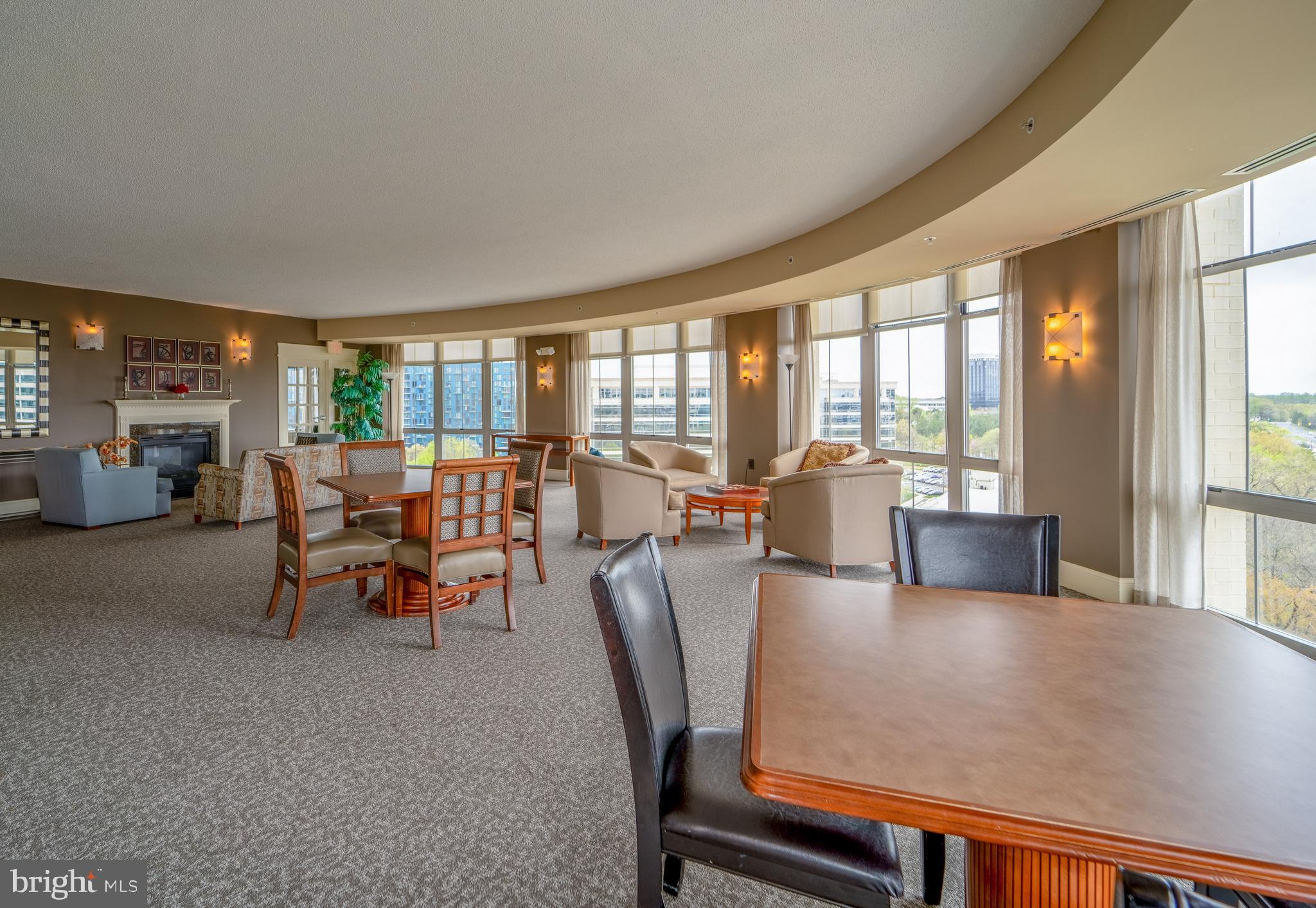 11800 Sunset Hills Road, Unit 925 Reston, VA 20190 - Photo 37 of 49 a living room with furniture and large windows