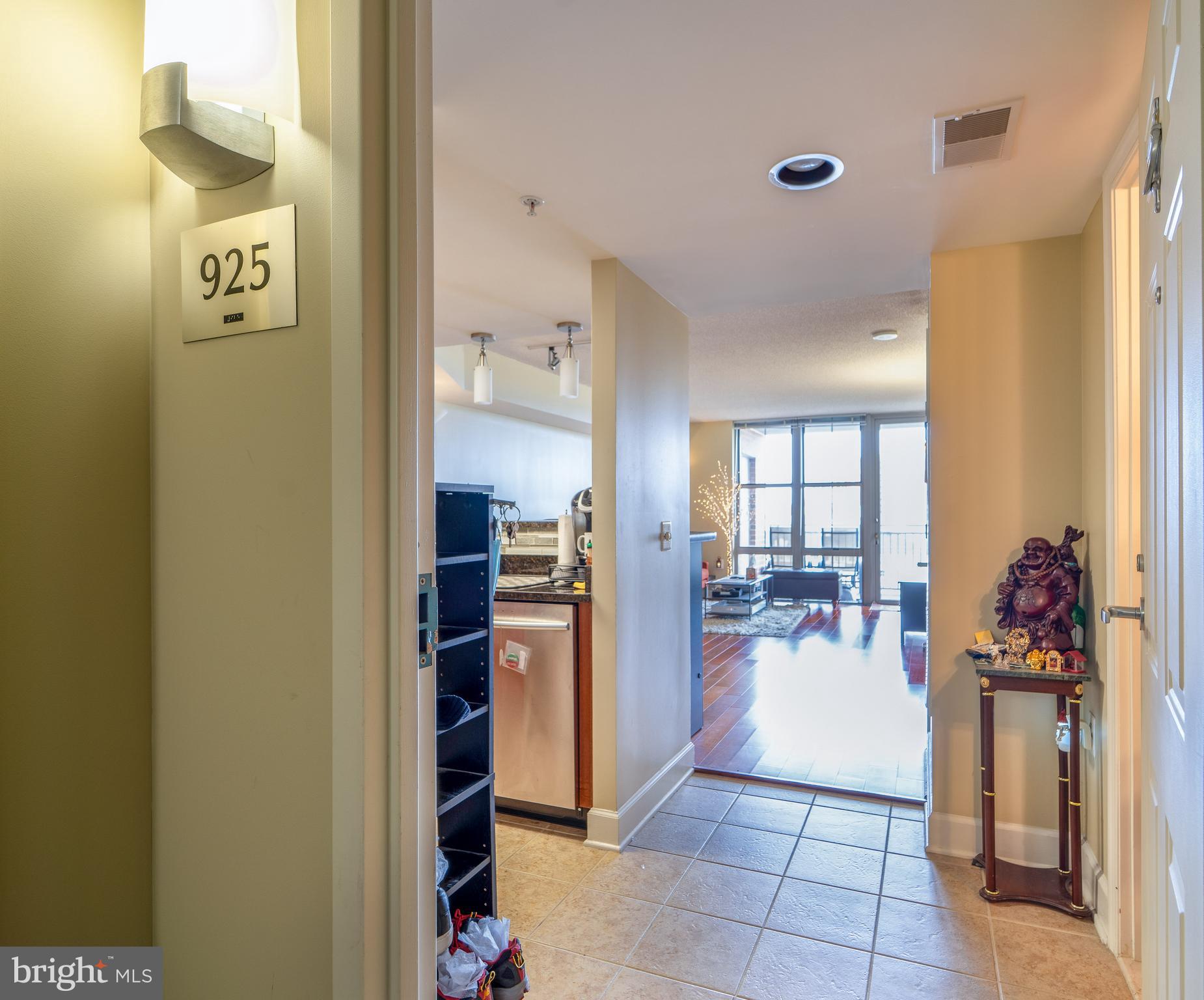 11800 Sunset Hills Road, Unit 925 Reston, VA 20190 - Photo 6 of 49 a view of a hallway to room with livingroom and furniture