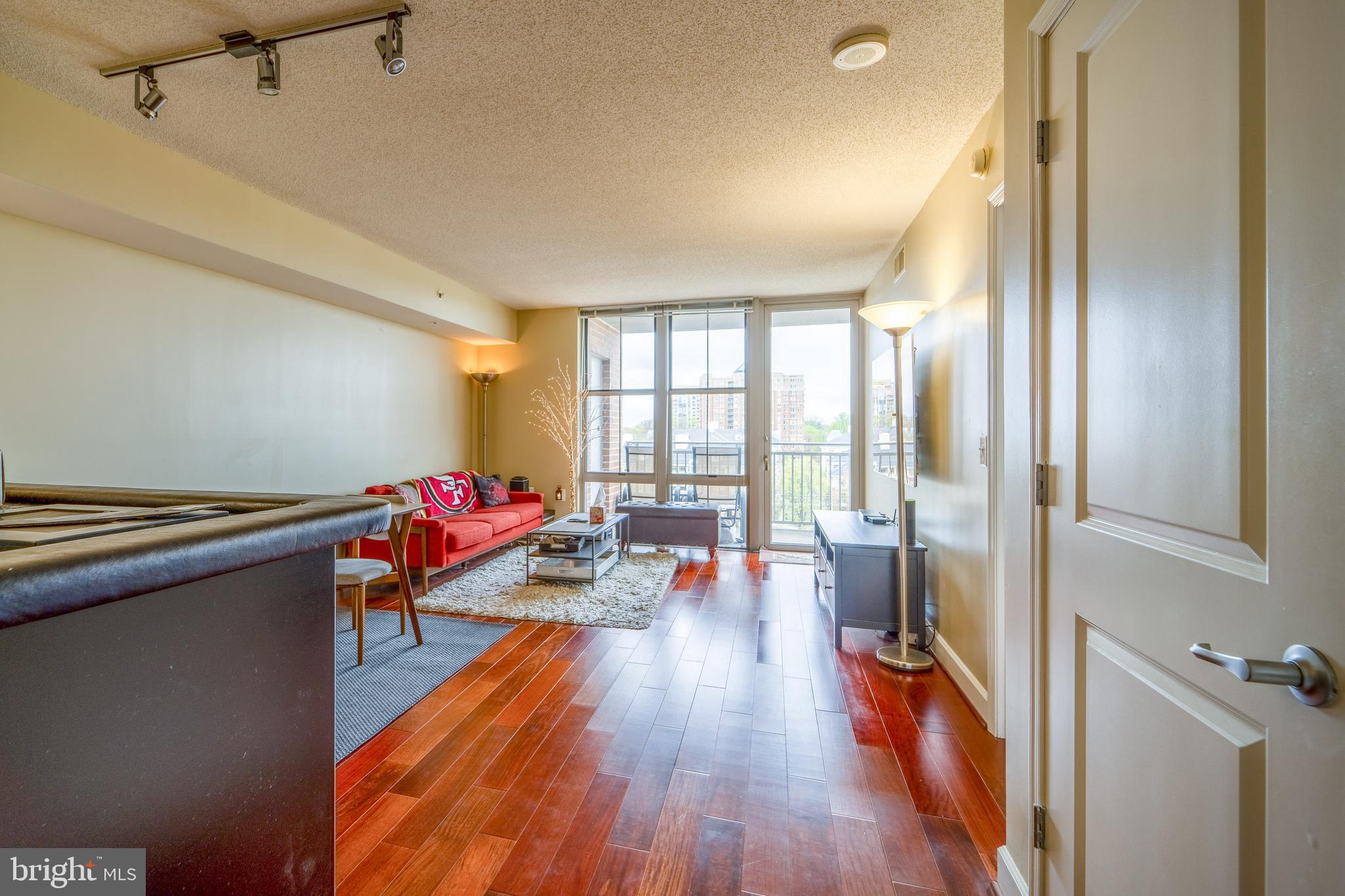 11800 Sunset Hills Road, Unit 925 Reston, VA 20190 - Photo 10 of 49 a living room with furniture and a wooden floor