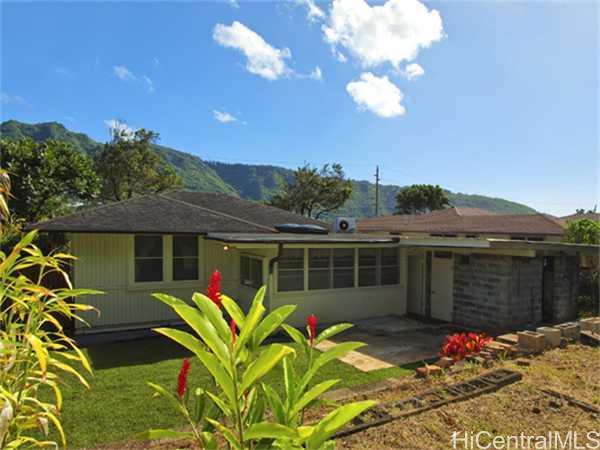 3340 Manoa Road Honolulu, HI 96822 - Photo 1 of 1 a view of a house with a large window and flower plants