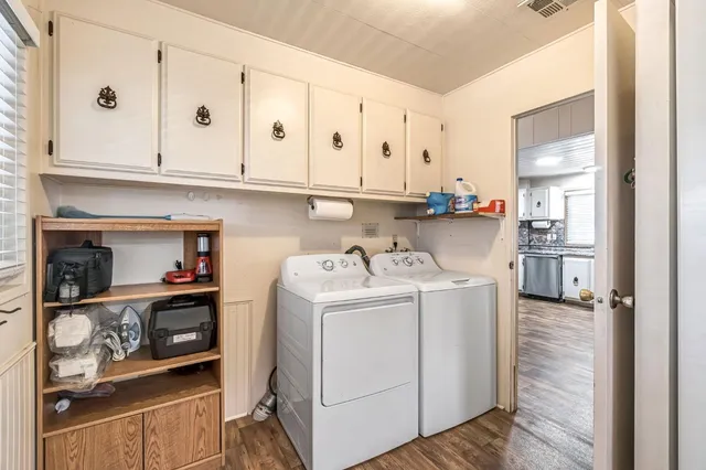 a view of kitchen and utility room with wooden floor