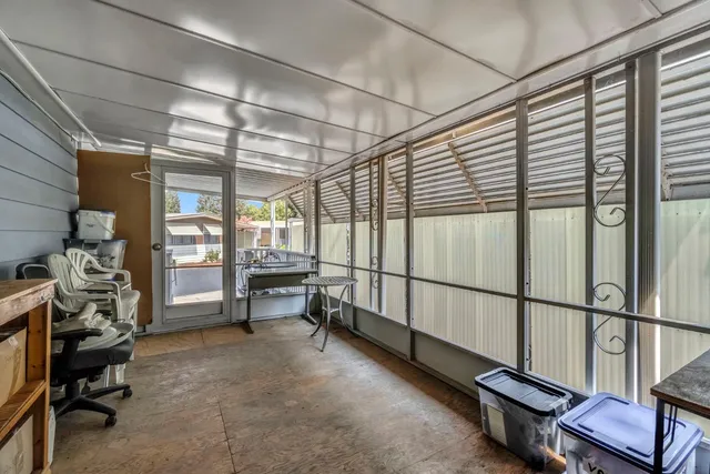 a room with lots of furniture and a window