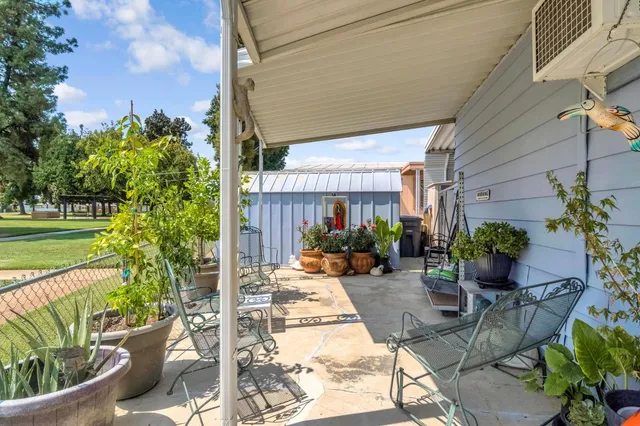 a view of a swimming pool with outdoor seating