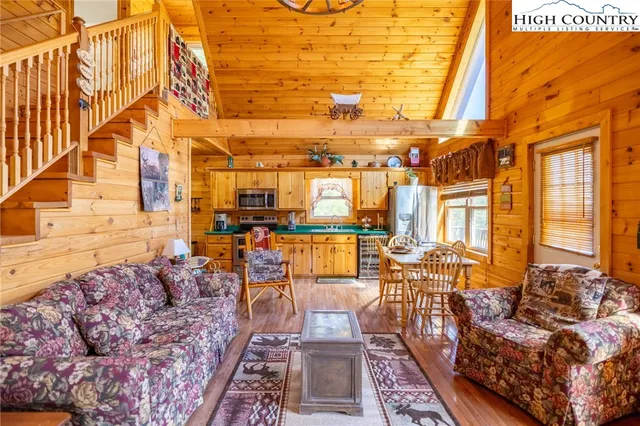 a living room with lots of furniture and a rug