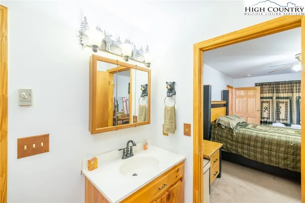 a en suite bathroom with sink and mirror
