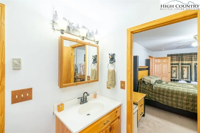 a en suite bathroom with sink and mirror