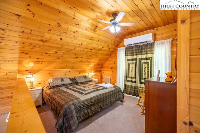 a bathroom with a granite countertop toilet sink and mirror